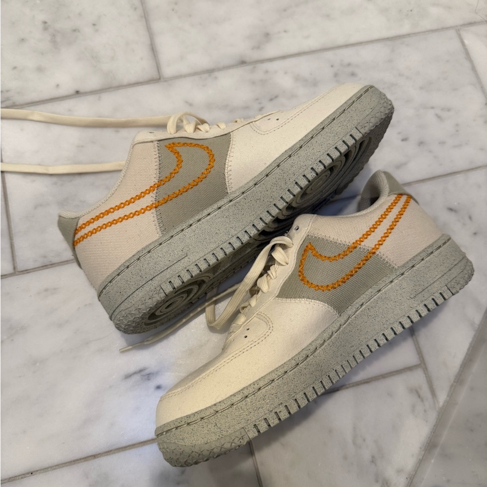 Nike Cream and Orange Athletic Shoes with Classic Design